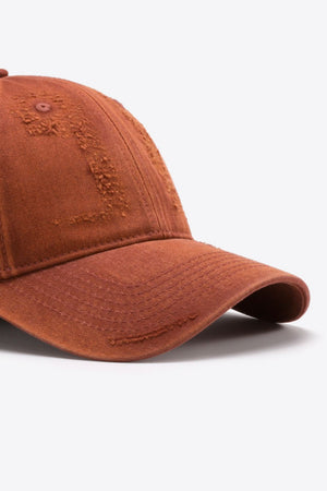 Terracotta baseball cap with distressed details and stitched brim