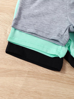 Baby boys' 4-piece underwear set in grey, mint, and black with tropical palm graphic detail.