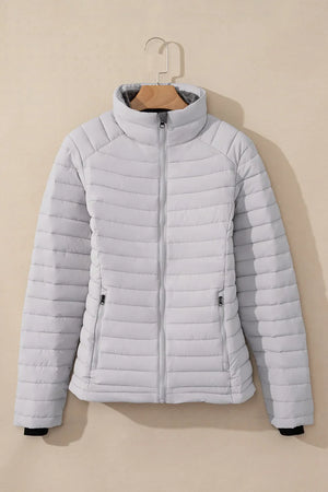 Gray quilted stand collar puffer jacket with zip pockets and full zip front.