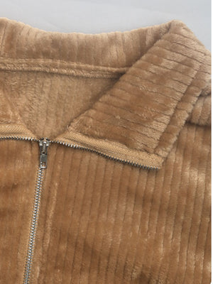 Camel plush corduroy zip-up jacket with fuzzy lining and collared neckline.