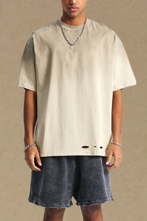 Taupe oversized tee with distressed hemline and neckline details.