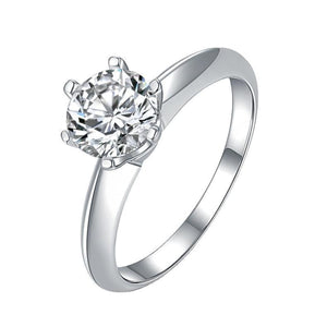 Sterling silver ring with a brilliant round moissanite solitaire stone.