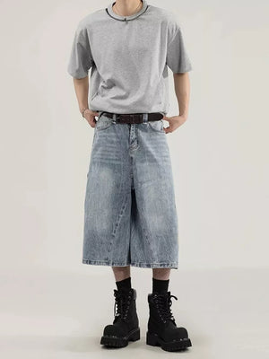 Men's light wash denim wide-leg capris with relaxed fit and cargo pockets.