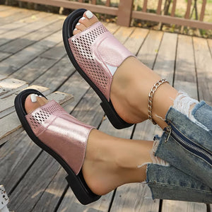 Chic pink hollow-out slide sandals with breathable mesh detail.