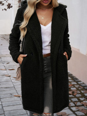 Black teddy hooded cocoon coat with double-breasted closure and pockets.