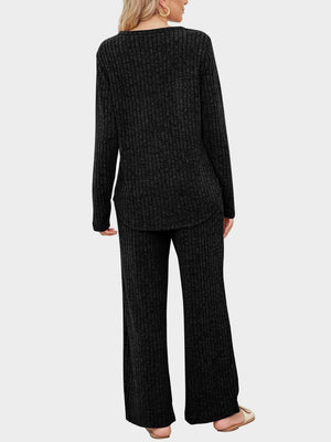 Black ribbed knit lounge set with long sleeve top and wide leg pants.
