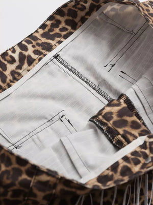 Men's leopard print cargo sweatpants with striped lining and visible stitching detail.