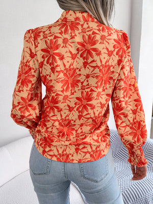 Floral print blouse in pumpkin with shirred cuffs and puff sleeves