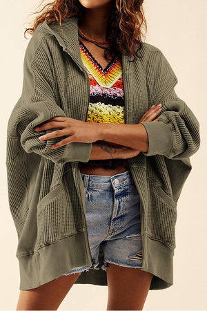 Army green waffle knit zip-through hoodie with pockets and a hood.