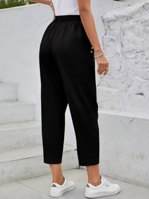 Black textured elastic waist cropped trousers with button detail