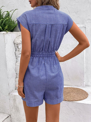 Blue striped shirting romper with cinched waist tie and buttoned collar.