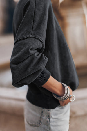 Acid wash black mock neck sweatshirt with ribbed cuffs and hem.