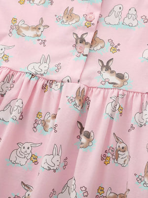 Pink cotton toddler dress with a cute bunny print and ruffled hem.