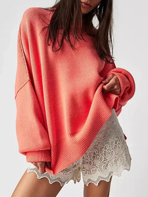 Oversized ribbed knit sweater in strawberry with drop shoulders and wide sleeves.