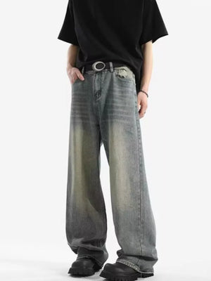 Men's relaxed fit vintage wash jeans with a baggy cut and distressed details.
