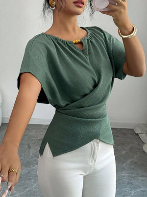 Green short sleeve maternity blouse with beaded keyhole neckline and wrap detail