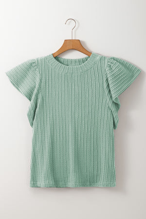 Textured cable knit top in Gum Leaf green with flutter sleeves and a mock neckline.