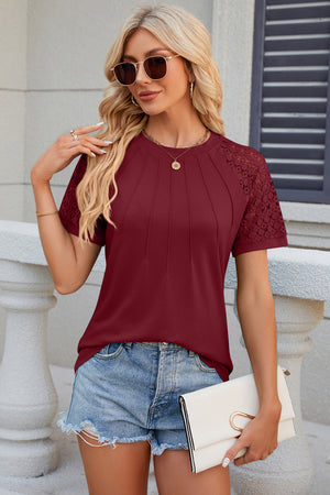 Burgundy ribbed tee with lace raglan sleeves and pleated detail.
