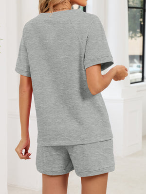 Gray loungewear shorts and matching t-shirt with short sleeves.