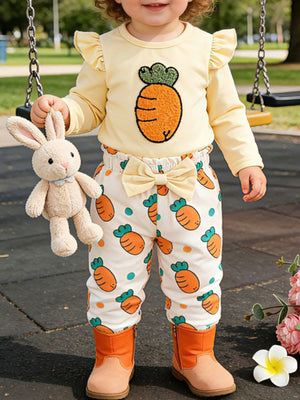 Baby girl's yellow carrot print outfit with ruffled sleeves and bow-waist pants.