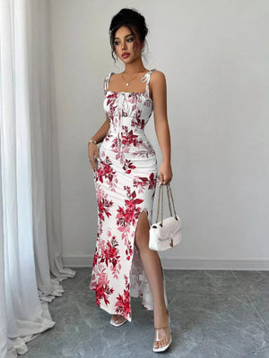 Floral print tie strap maxi dress in white with red flowers, ruched bodice, and thigh-high slit.