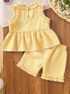 Yellow gingham cotton two-piece set with ruffled trim and peplum top.