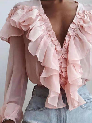 Pink chiffon ruffle plunge blouse with sheer sleeves and ruffled neckline.