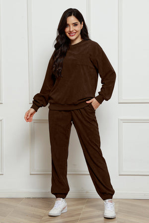 Chocolate corduroy loungewear set with crewneck sweatshirt and pocket detail.