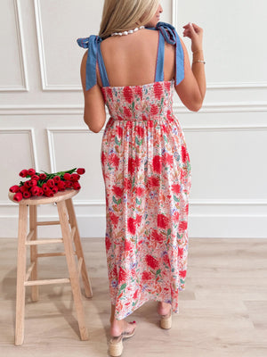 Floral print midi dress with smocked bodice and tie-shoulder straps.