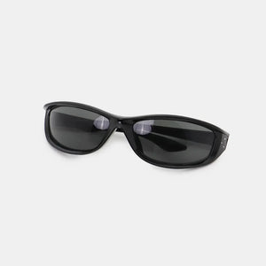 Black sculpted sport sunglasses with dark lenses and studded accents.