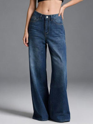 Cutout high-waisted wide-leg jeans in blue denim with button closure.