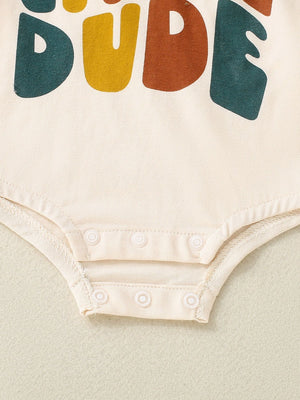 Baby bodysuit in beige with colorful "DUDE" graphic and snap closure