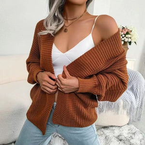 Brown chunky knit dolman sleeve cardigan with ribbed texture and open front.