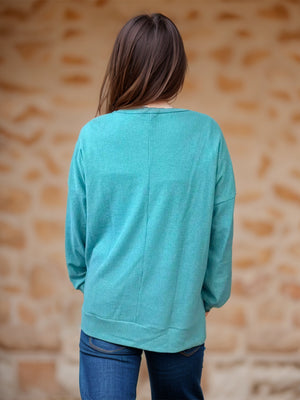 Waffle knit crewneck top in Pastel Blue with relaxed fit and long sleeves.