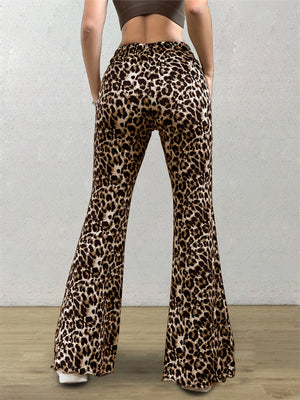 Leopard print bell bottom pants with a flared leg and elastic waistband.