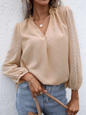 Khaki Swiss dot sleeve gathered blouse with V-neck and ruffled neckline.