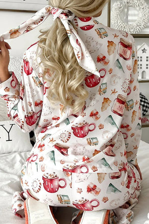 White collared pajama set with festive holiday print of mugs, gifts, and trees.