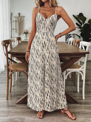 Backless wide-leg jumpsuit with abstract print and spaghetti straps.