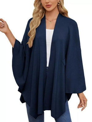 Navy knit cape top with draped elegance and open front.