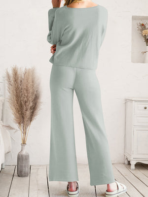 Light gray acrylic loungewear set with wide-leg pants and long-sleeve top.