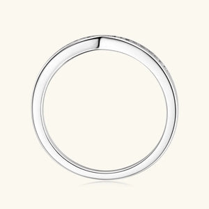 Silver moissanite chevron contour band ring with small stones.