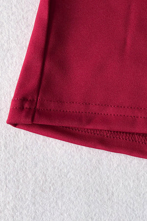 Deep Red belted palazzo jumpsuit hem detail with double stitching