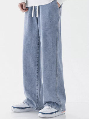Light blue relaxed wide-leg jeans with drawstring waist and pockets.