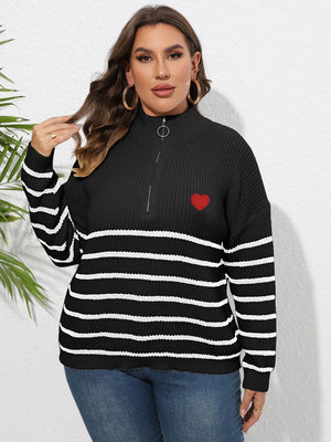 Black ribbed knit sweater with white stripes, red heart appliqué, and quarter zip band collar.