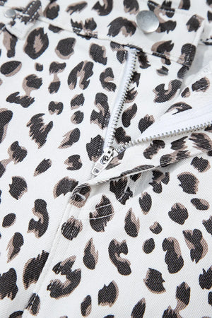 Leopard print denim shorts with frayed hem detail and zip fly.