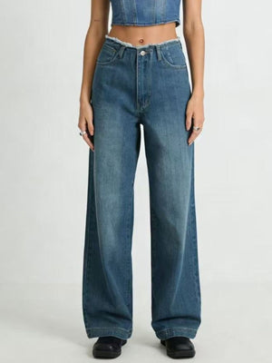 Blue cotton maternity jeans with a frayed hem and wide leg
