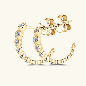 Gold moissanite pavé hoop earrings with bezel-set stones