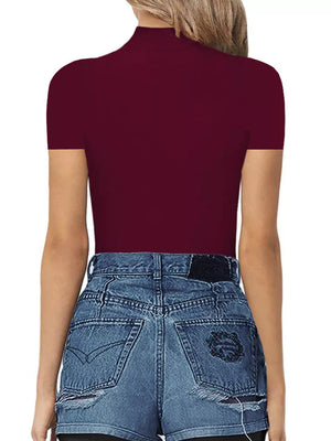 Burgundy mock neck short sleeve bodysuit styled with denim shorts.