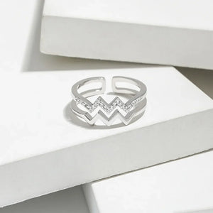 Silver zigzag split band ring with pave crystal accents