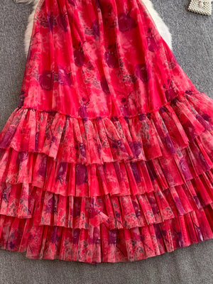 Maxi dress in pink floral print mesh with tiered ruffles and a tie-dye effect.